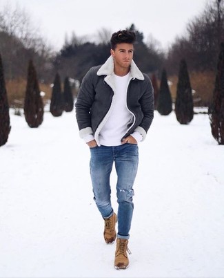 Black Shearling Jacket Outfits For Men: Exhibit your credentials in men's fashion in this city casual combo of a black shearling jacket and blue ripped skinny jeans. Why not introduce a pair of tan nubuck casual boots to the mix for an added touch of refinement?