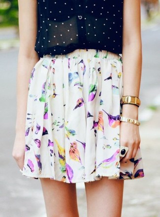 White and Black Print Skater Skirt Outfits: For an edgy and casual outfit, dress in a black and white polka dot sleeveless button down shirt and a white and black print skater skirt — these items fit nicely together.