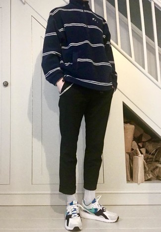 Black and White Sweater Outfits For Men: A black and white sweater and black chinos are a good pairing that will easily carry you throughout the day. A pair of white and blue athletic shoes will tie the whole thing together.