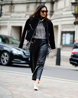 Black Leather Wide Leg Pants Outfits: Stylish yet comfy, this look is comprised of a black wool biker jacket and black leather wide leg pants. For something more on the sophisticated end to complete your ensemble, complement this ensemble with white leather pumps.