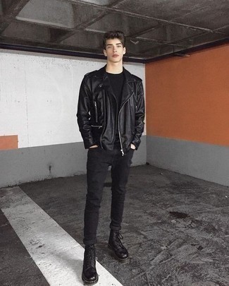 A black leather biker jacket and black skinny jeans are an urban combination that every modern guy should have in his menswear collection. If you want to easily up the style ante of your look with shoes, add black leather casual boots to the mix.