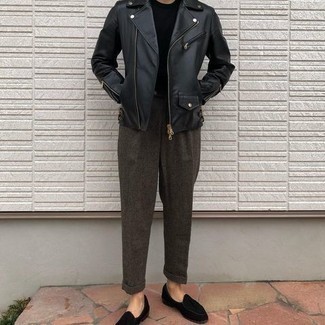 Dark Brown Wool Chinos Outfits: Exhibit your prowess in menswear styling by wearing this relaxed pairing of a black leather biker jacket and dark brown wool chinos. Inject this ensemble with an element of polish with a pair of black suede tassel loafers.