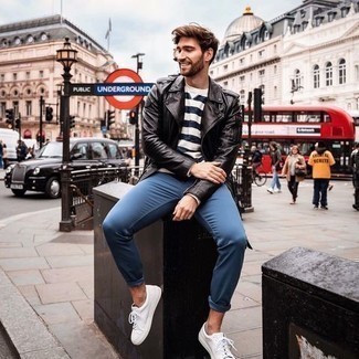 Black Biker Jacket Outfits For Men: Fashionable and functional, this casual pairing of a black biker jacket and blue chinos will provide you with endless styling possibilities. White canvas low top sneakers integrate perfectly within a myriad of combinations.