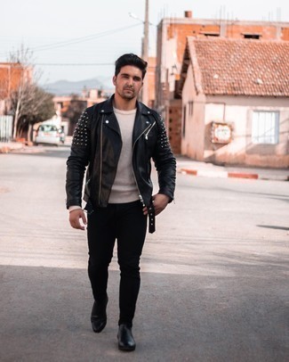 Black Studded Leather Biker Jacket Outfits For Men: If you love comfort dressing, why not opt for this combination of a black studded leather biker jacket and black skinny jeans? Black leather chelsea boots are an effective way to upgrade your look.