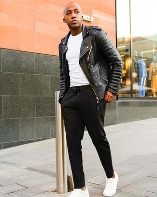 Black Quilted Leather Biker Jacket Outfits For Men: This combination of a black quilted leather biker jacket and black vertical striped chinos is on the casual side but is also sharp and incredibly dapper. A pair of white canvas low top sneakers looks wonderful rounding off your getup.