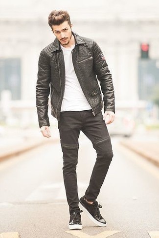 Black and White Leather Low Top Sneakers Outfits For Men: Such items as a black leather biker jacket and black jeans are an easy way to introduce effortless cool into your off-duty repertoire. Black and white leather low top sneakers integrate effortlessly within a variety of outfits.