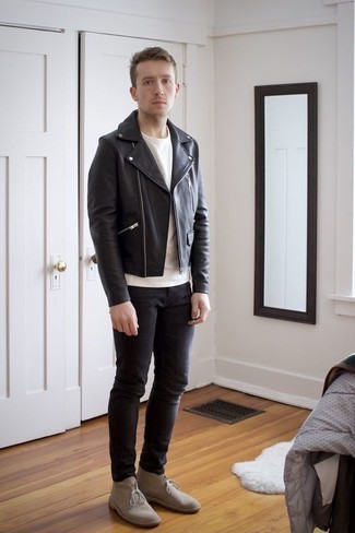 Pair a black leather biker jacket with charcoal jeans to feel absolutely confident and look casually stylish. Put a different spin on this look by slipping into a pair of beige suede desert boots.