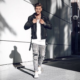 Black Suede Biker Jacket Outfits For Men: A black suede biker jacket and grey ripped jeans are awesome menswear pieces to add to your casual styling repertoire. To give your overall outfit a dressier twist, why not add a pair of white and black leather low top sneakers to the mix?
