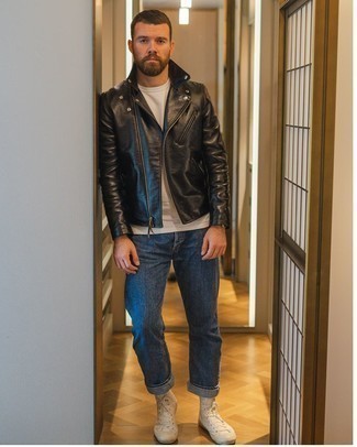 Navy Jeans Spring Outfits For Men: One of the coolest ways for a man to style out a black leather biker jacket is to team it with navy jeans in a laid-back getup. When it comes to shoes, go for something on the relaxed end of the spectrum and complete this outfit with a pair of white canvas high top sneakers. So if you're looking for an ensemble that's stylish but also feels totally season-appropriate, you found it.