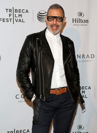 Jeff Goldblum wearing Black Leather Biker Jacket, White Dress Shirt, Navy Chinos, Tobacco Leather Belt