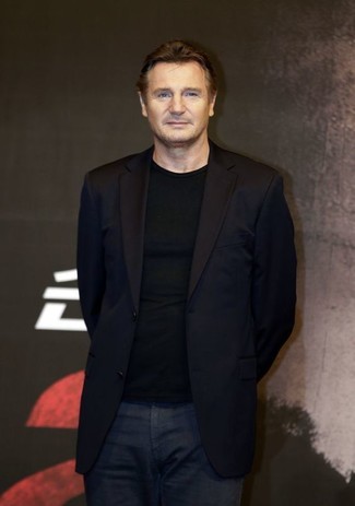 Liam Neeson wearing Black Blazer, Black Crew-neck Sweater, Navy Jeans