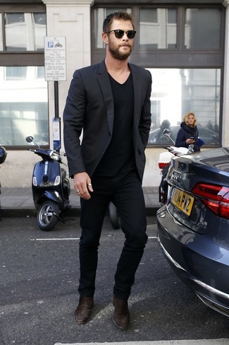Chris Hemsworth wearing Black Blazer, Black V-neck T-shirt, Black Chinos, Dark Brown Suede Chelsea Boots