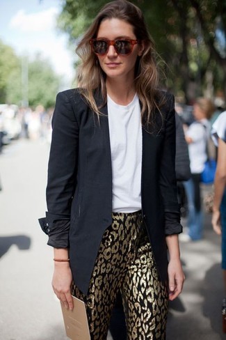 For a casual and cool ensemble, wear a black blazer with gold leopard leggings — these items work pretty good together.