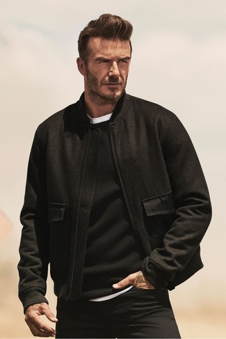 David Beckham wearing Black Wool Bomber Jacket, Black Crew-neck Sweater, White Crew-neck T-shirt, Black Jeans