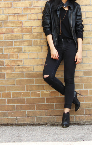A black leather bomber jacket and black ripped skinny jeans are absolute essentials that will integrate well within your casual styling rotation. A pair of black leather ankle boots will easily polish off any getup.
