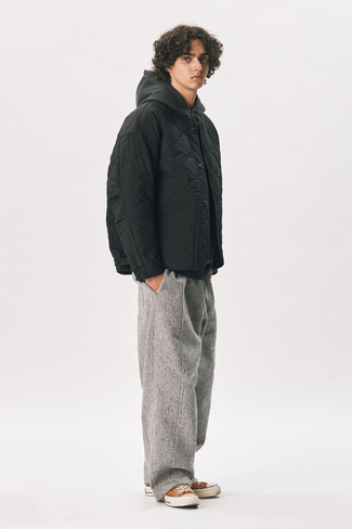 Grey Wool Chinos Outfits: A black quilted bomber jacket and grey wool chinos are the ideal way to infuse some cool into your daily styling lineup. Let your styling credentials really shine by finishing off this ensemble with orange canvas low top sneakers.