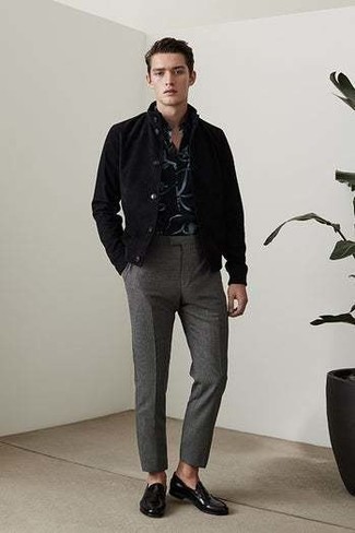 Black Print Short Sleeve Shirt Outfits For Men: This combo of a black print short sleeve shirt and charcoal chinos is on the casual side but is also sharp and extra stylish. Serve a little outfit-mixing magic with a pair of black leather loafers.