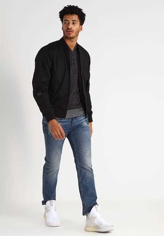 Men's Black Bomber Jacket, Charcoal Henley Sweater, Blue Jeans, White Athletic Shoes
