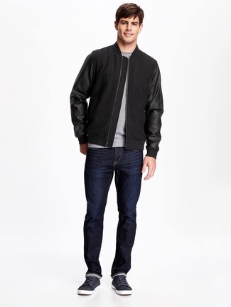 Blue Leather Low Top Sneakers Outfits For Men: A black bomber jacket and navy jeans worn together are a match made in heaven for men who love casual and cool styles. Complete this ensemble with blue leather low top sneakers and ta-da: this ensemble is complete.
