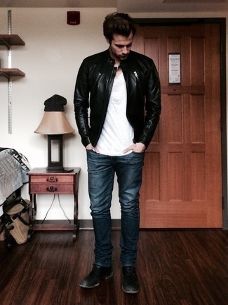 Black Leather Bomber Jacket Outfits For Men: Fashionable and functional, this laid-back pairing of a black leather bomber jacket and navy jeans will provide you with a multitude of styling opportunities. Channel your inner David Gandy and class up your look with black leather chelsea boots.