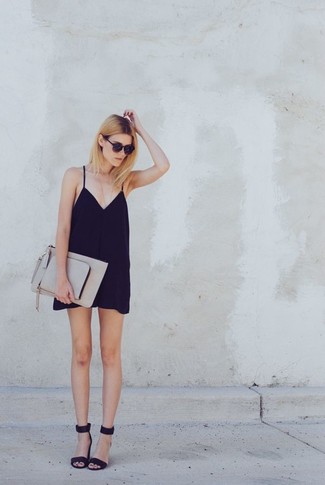 Grey Leather Clutch Outfits: A black silk cami dress and a grey leather clutch are a pairing that every cool girl should have in her off-duty styling lineup. If you want to immediately elevate your getup with one piece, why not complete this ensemble with a pair of black suede heeled sandals?