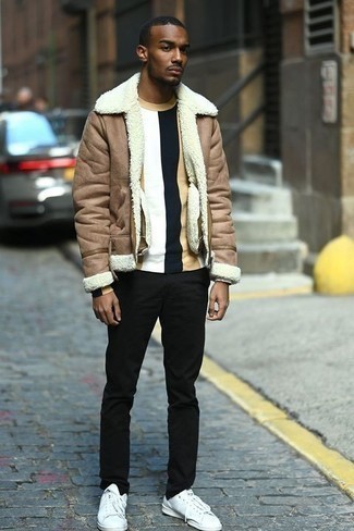 Men's White Canvas Low Top Sneakers, Black Chinos, Multi colored Long Sleeve T-Shirt, Tan Shearling Jacket