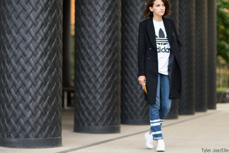 Women's Black Coat, White and Black Print Crew-neck T-shirt, Blue Horizontal Striped Jeans, White Low Top Sneakers