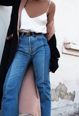 Navy Flare Jeans Outfits: A black coat and navy flare jeans make for the perfect foundation for an endless number of chic combinations.