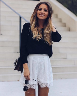 White Lace Shorts Outfits For Women: This combination of a black crew-neck sweater and white lace shorts is on the casual side but guarantees that you look totaly stylish and elegant.