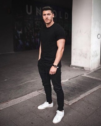 Black Chinos Summer Outfits: This combo of a black crew-neck t-shirt and black chinos is on the off-duty side yet it's also dapper and really sharp. Our favorite of a multitude of ways to complement this outfit is with white canvas low top sneakers. This ensemble is ideal when it's baking hot outside.