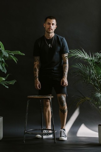 Black Denim Shorts Outfits For Men: Go for a straightforward but laid-back and cool option marrying a black crew-neck t-shirt and black denim shorts. A pair of black and white canvas low top sneakers looks perfect complementing your look.