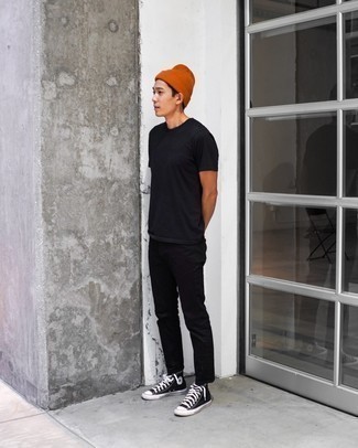 Orange Beanie Outfits For Men: A black crew-neck t-shirt and an orange beanie are amazing menswear staples that will integrate brilliantly within your current casual routine. Go ahead and add a pair of black and white canvas high top sneakers to your outfit for a dose of class.