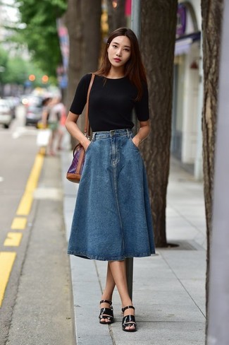 Navy Denim Midi Skirt Outfits: If you don't like being too serious with your combos, choose a black crew-neck t-shirt and a navy denim midi skirt. And it's amazing what a pair of black leather heeled sandals can do for the ensemble.