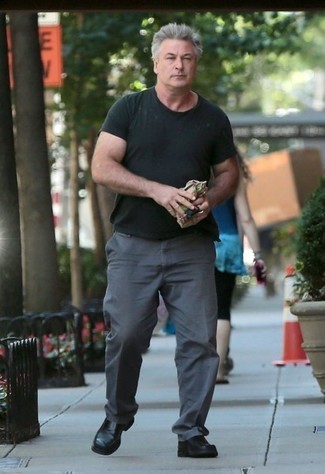 Alec Baldwin wearing Black Crew-neck T-shirt, Charcoal Chinos, Black Leather Loafers