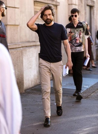 Beige Chinos Hot Weather Outfits: Putting together a black crew-neck t-shirt with beige chinos is a great pick for an off-duty outfit. For a more elegant feel, why not add black leather loafers to the mix?