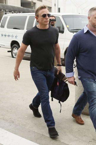 Dress in a black crew-neck t-shirt and navy jeans to assemble an interesting and modern-looking laid-back ensemble. Balance your look with a more refined kind of footwear, such as this pair of black suede desert boots.