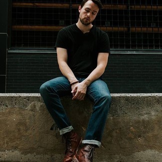 Tobacco Leather Casual Boots Warm Weather Outfits For Men: Try teaming a black crew-neck t-shirt with navy jeans to show off your styling smarts. For a more sophisticated feel, why not complete your getup with a pair of tobacco leather casual boots?