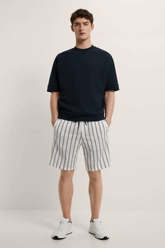 White and Navy Athletic Shoes Outfits For Men: If you appreciate functionality above all, dress in a black crew-neck t-shirt and white and black vertical striped sports shorts. On the footwear front, this look pairs nicely with white and navy athletic shoes.