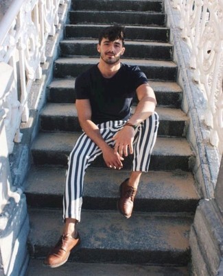 Brown Leather Derby Shoes Outfits: A black crew-neck t-shirt and white and navy vertical striped chinos are the kind of a never-failing casual combo that you so awfully need when you have no time. For maximum effect, add brown leather derby shoes to the mix.