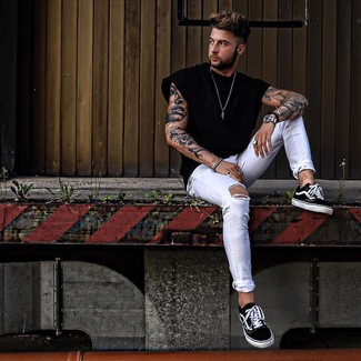 White Skinny Jeans Outfits For Men: This relaxed casual pairing of a black crew-neck t-shirt and white skinny jeans is effortless, dapper and very easy to recreate. Puzzled as to how to complete your outfit? Wear black and white canvas low top sneakers to dial it up.