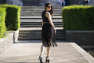 Black Fringe Midi Skirt Outfits: If you gravitate towards casual getups, why not try this combination of a black cropped top and a black fringe midi skirt? Go ahead and add a pair of black leather heeled sandals to this outfit for an extra dose of chic.