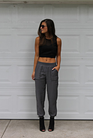 Charcoal Tapered Pants Outfits For Women: Look chic yet functional in a black cropped top and charcoal tapered pants. To bring a bit of zing to this outfit, introduce a pair of black cutout suede ankle boots to the equation.