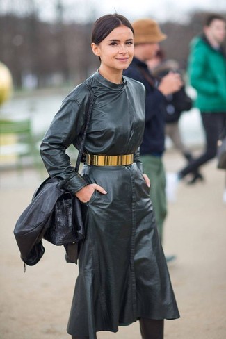 Miroslava Duma wearing Gold Waist Belt, Black Leather Crossbody Bag, Black Leather Knee High Boots, Black Leather Midi Dress