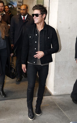 Zac Efron wearing Black Denim Jacket, Grey V-neck T-shirt, Black Jeans, Black Leather Low Top Sneakers