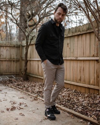 Black Crew-neck T-shirt Outfits For Men: Effortlessly blurring the line between dapper and casual, this pairing of a black crew-neck t-shirt and khaki check chinos can easily become one of your go-tos. Up this whole getup by sporting black athletic shoes.