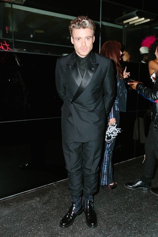 Richard Madden wearing Black Leather Chelsea Boots, Black Dress Pants, Black Dress Shirt, Black Double Breasted Blazer
