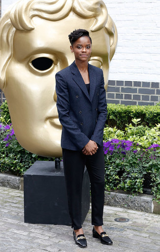 Letitia Wright wearing Black Leather Loafers, Black Dress Pants, Black Tank, Navy Double Breasted Blazer