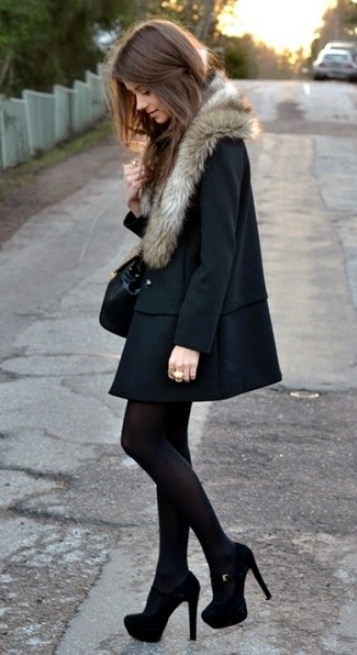 Go all out in a black fur collar coat. A pair of black suede pumps looks perfectly at home here.