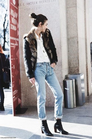 Black Leather Ankle Boots Outfits: This combination of a black fur jacket and light blue boyfriend jeans will allow you to assert your styling expertise even on off-duty days. A chic pair of black leather ankle boots is the most effective way to add a dose of polish to this ensemble.