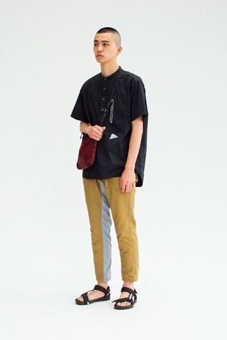 Black Canvas Sandals Outfits For Men: A black henley shirt and khaki chinos are both versatile menswear must-haves that will integrate perfectly within your daily styling rotation. Go off the beaten track and spice up your outfit with black canvas sandals.